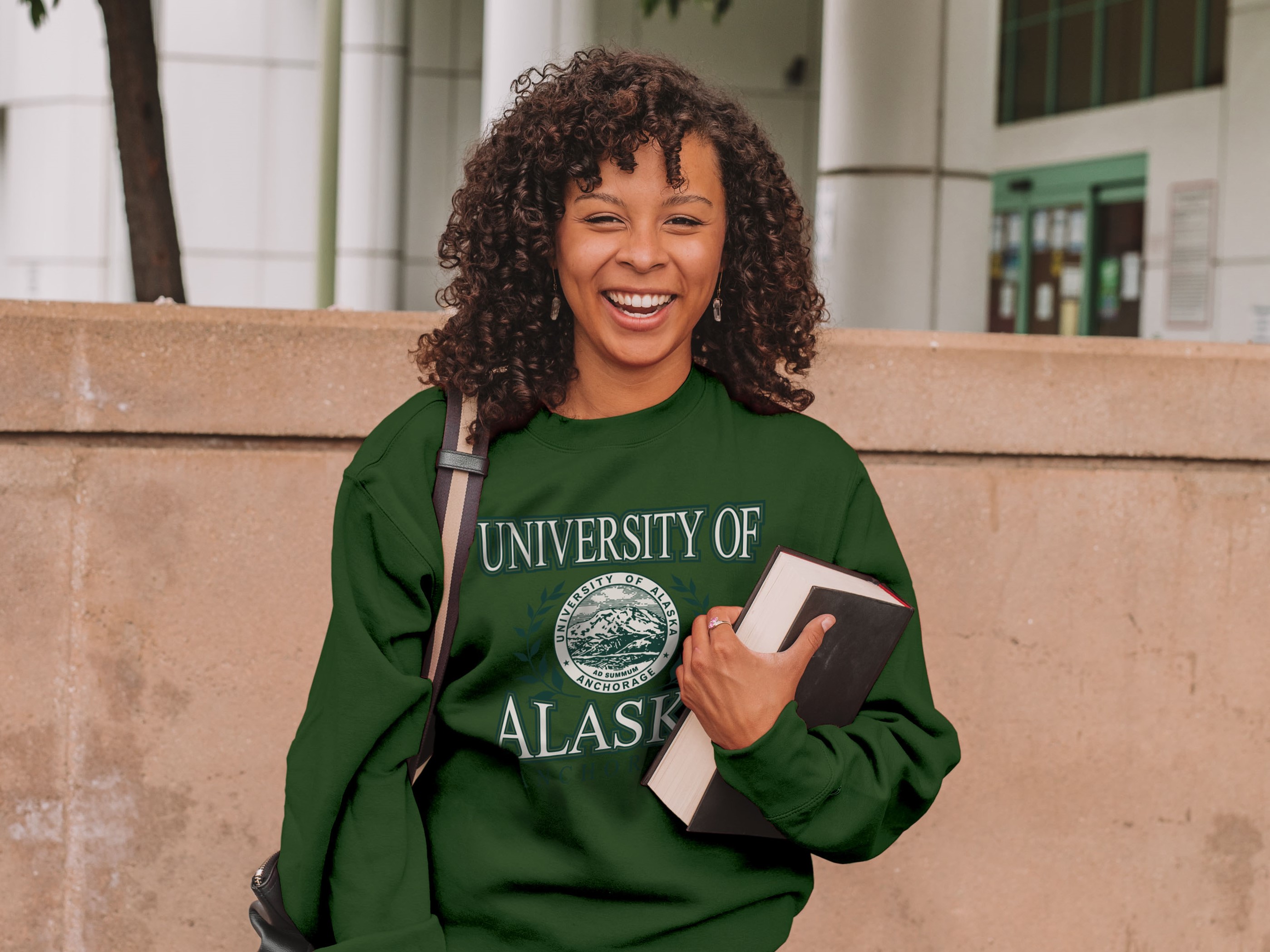 Student wearing green ɫƬ sweatshirt